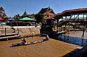 Inle Lake Myanmar. All the buildings are constructed on piles. Residents travel around by canoe, but there are also bamboo walkways and bridges over the canals, monasteries and stupas. 